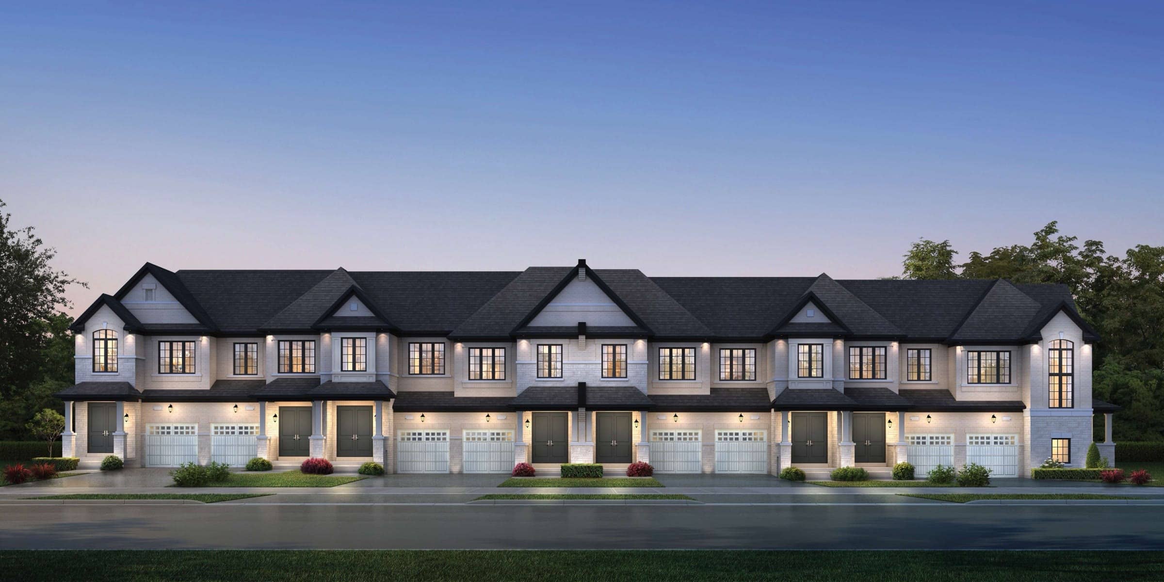 Row of new two-storey townhomes at dusk