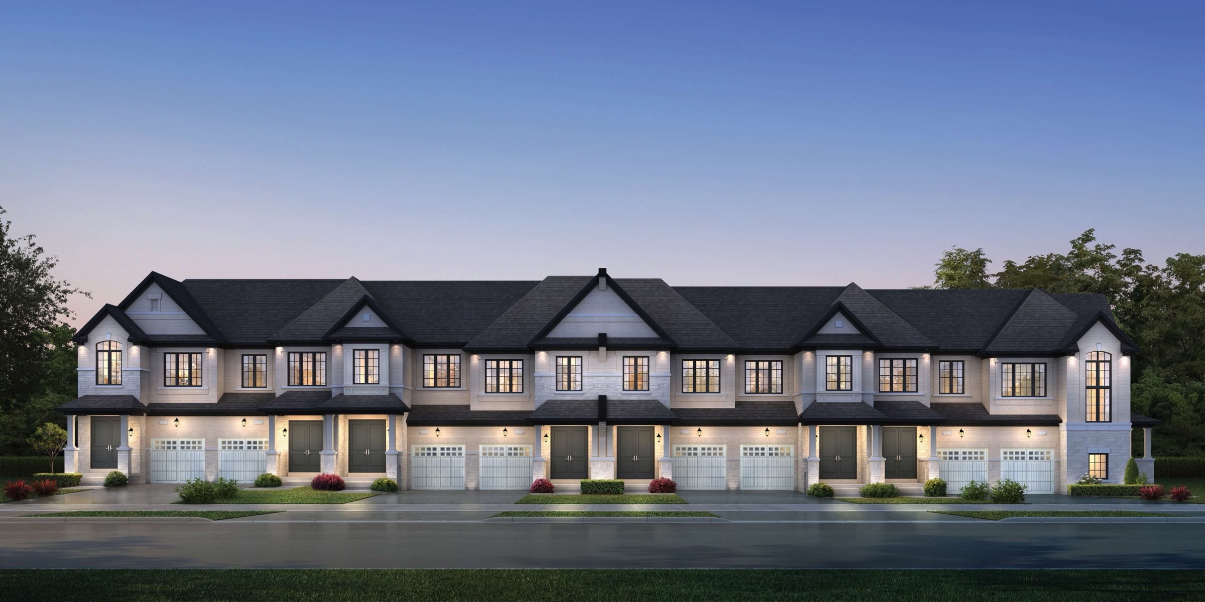 Row of new two-storey townhomes at dusk