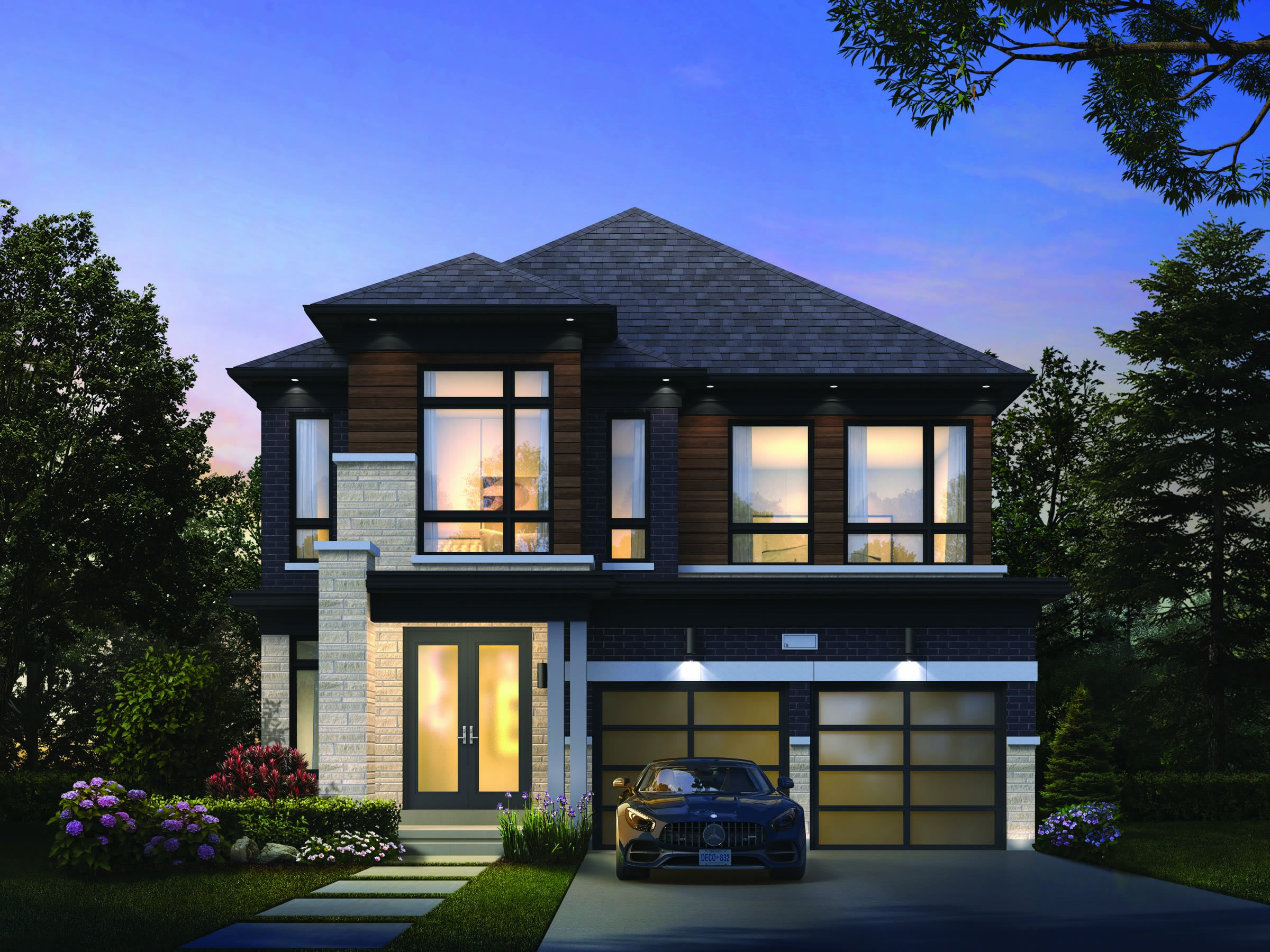 Modern two-storey detached home with a double garage at twilight